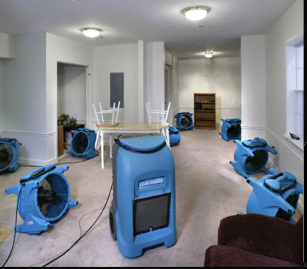 Air movers and dehumidifier setup for Water Damage Restoration in Ross